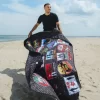 Manta de playa plegable Global Mogull Unlimited Miles, resistente al agua, convertible en bolso. Manta de playa plegable Global Mogull Unlimited Miles, resistente al agua, convertible en bolso.
