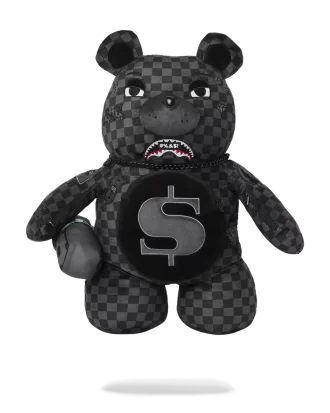 Mochila con forma de tiburón y osito de peluche.